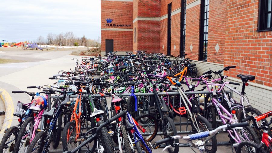 A full bike rack outside a Michigan elementary school