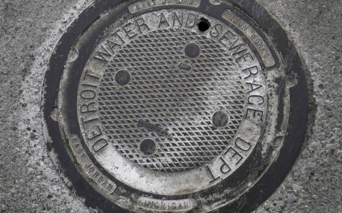 manhole cover that reads "Detroit Water and Sewer Department"