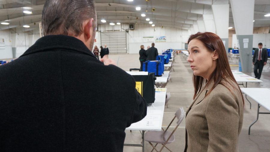 Ingham County Clerk Barb Byrum (right) confers with an attorney from the campaign of President-elect Donald Trump at recount.