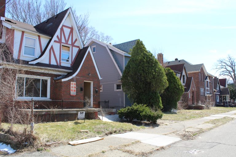 homes on a street boarded up LH
