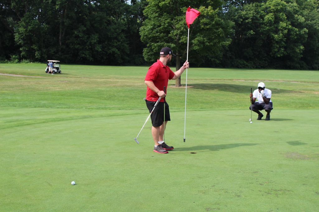 rouge park golf course holding flag