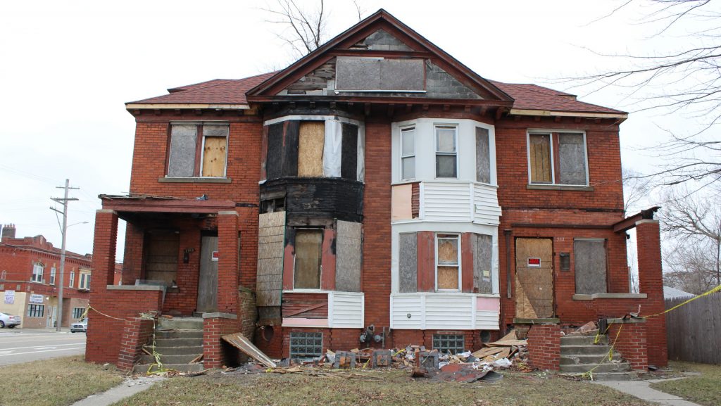 A boarded up home on a Detroit street