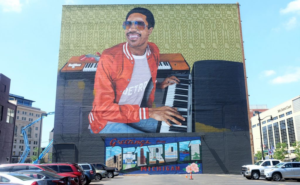 A mural of Stevie Wonder on the side of a building in Detroit