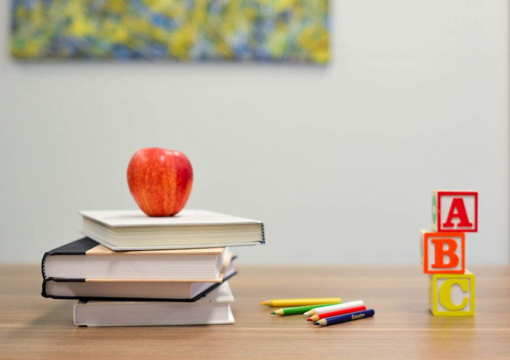 Stock photo of textbooks and desk.