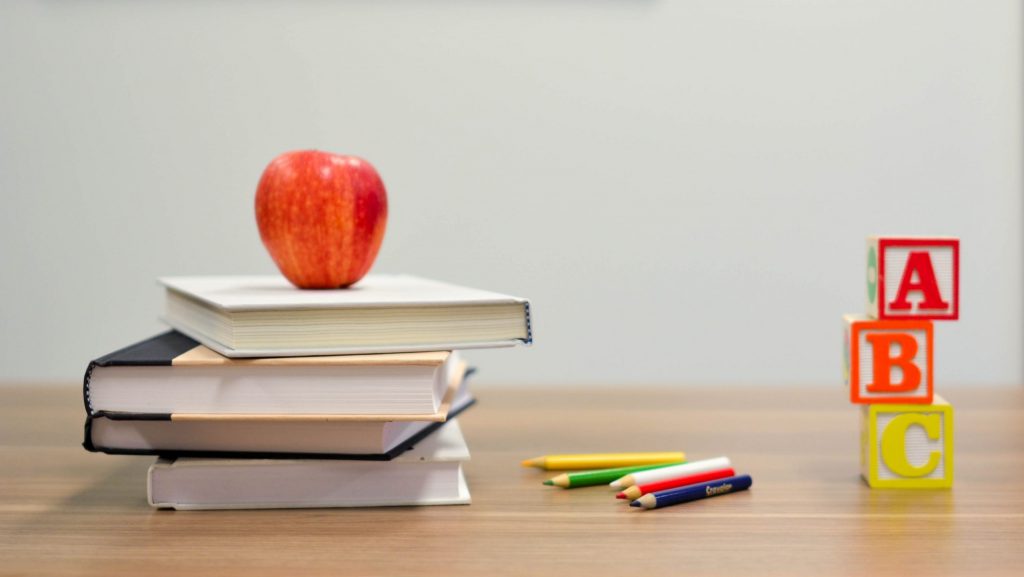 Stock photo of textbooks and desk.