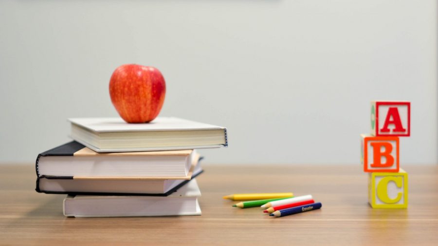Stock photo of textbooks and desk.