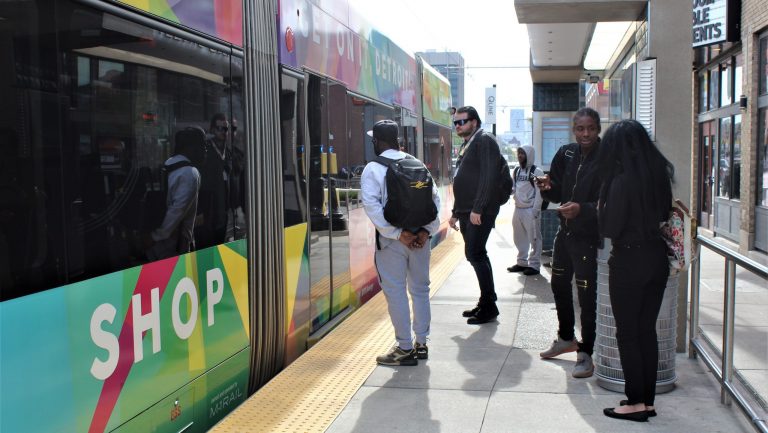 People waiting for the Qline