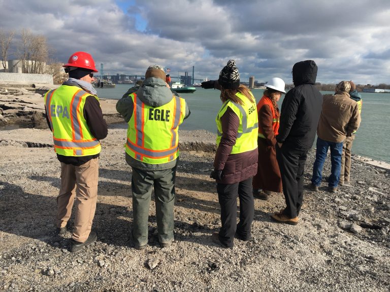 A group from EGLE are taking samples from the Detroit River.