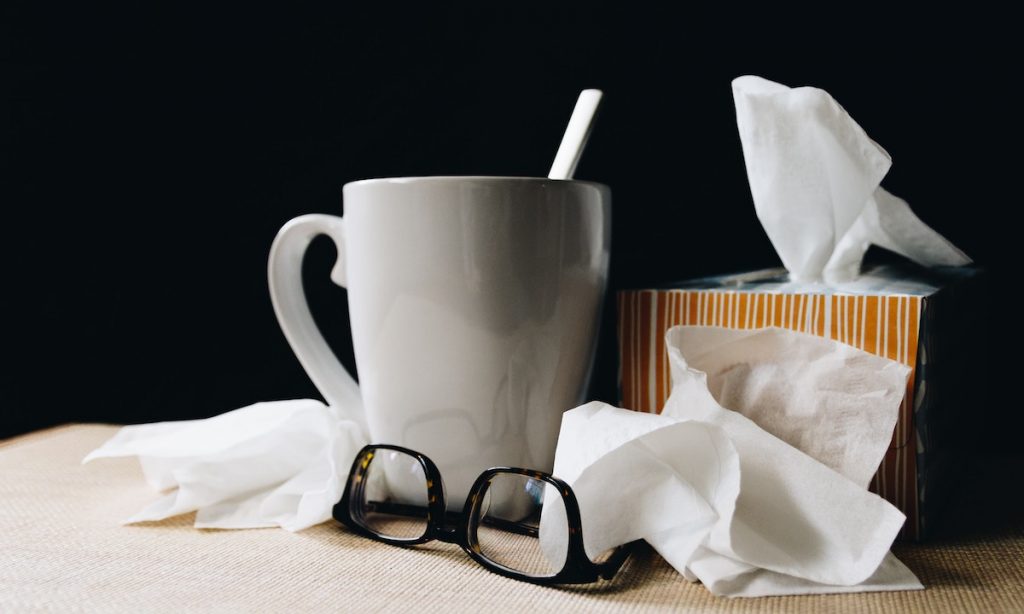 Cup, glasses, and tissues