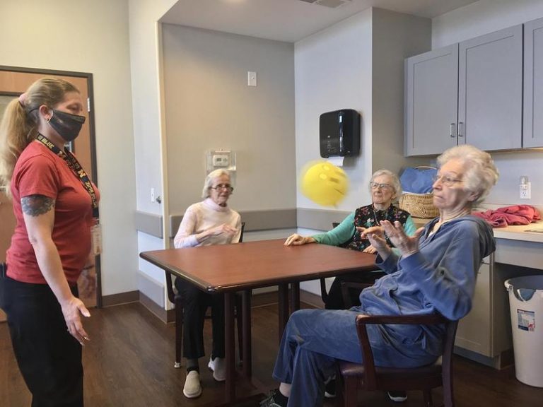 Jamie Capp helps residents at New Hope Valley