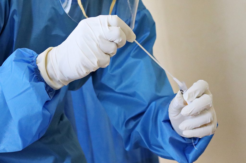 Laboratory worker takes a swab test