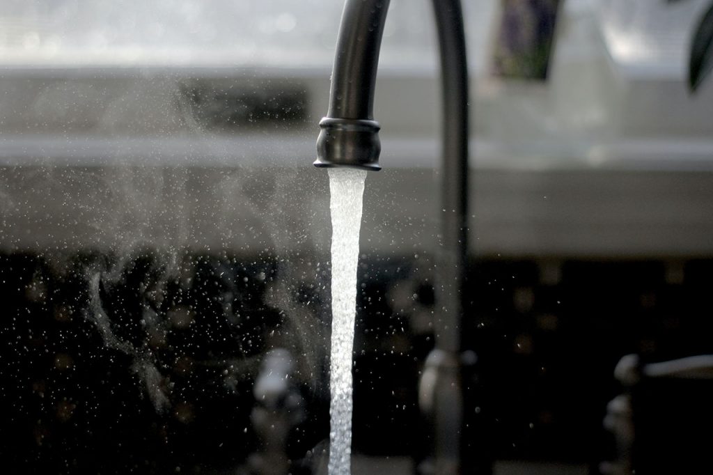 Tap water running from faucet