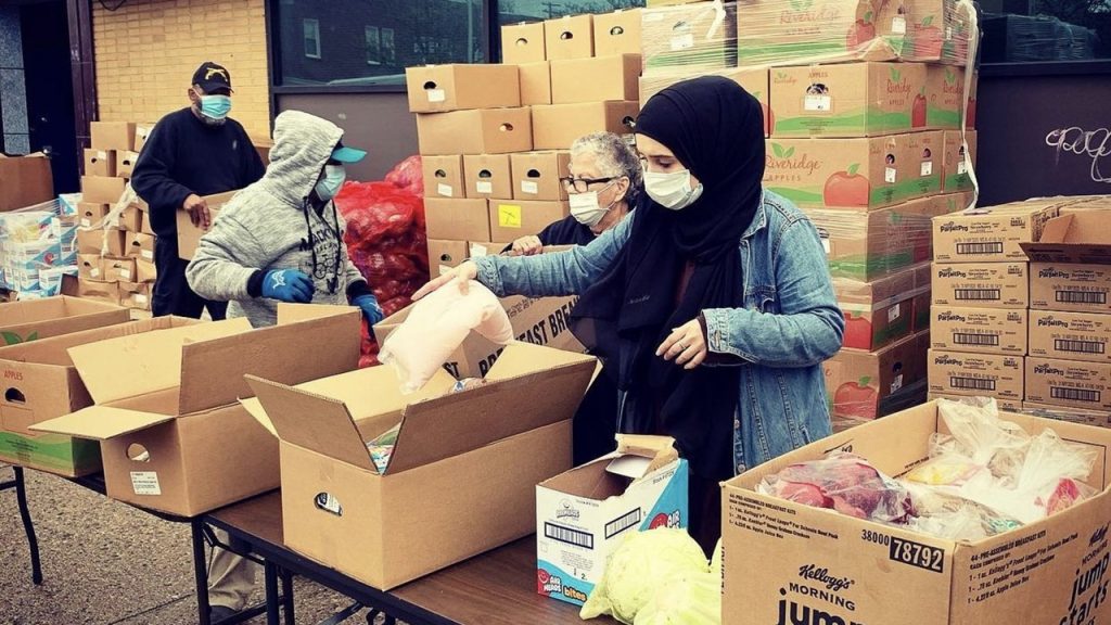 J&E Community Relief Emina Ferizovic passing out food