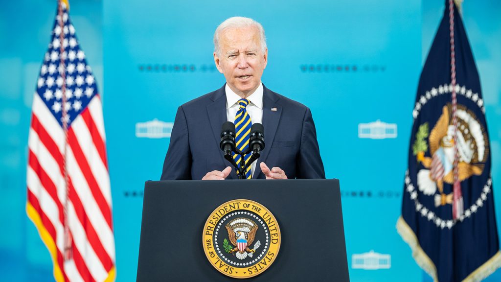 President Biden speaks at a podium