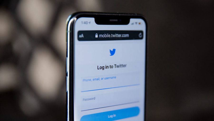 A mobile phone with Twitter pulled up on the screen