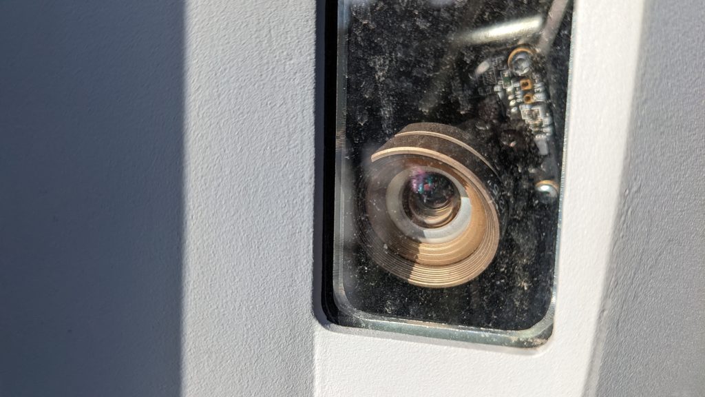 Close-up of a camera in a parking meter.