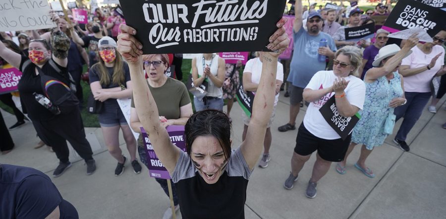 Abortion rights supporters hold signs at a demonstration