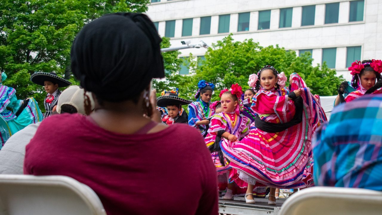 A group of children perform a traditional latin dance