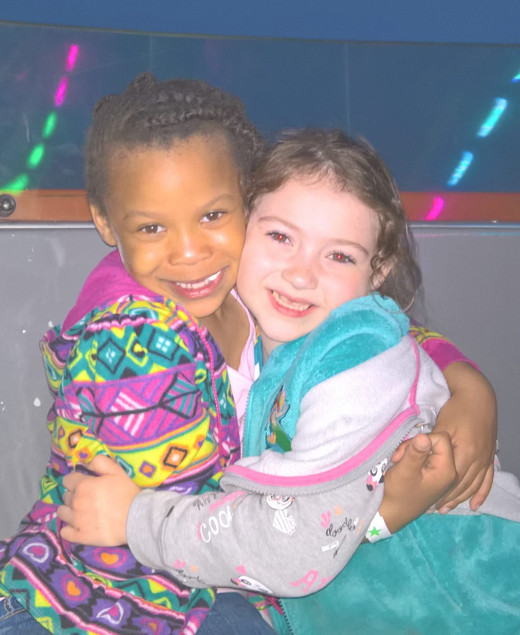 Friends sharing carnival ride