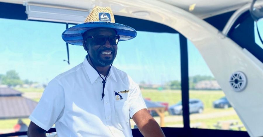 Jason McGuire on a boat at the Riverside Marina