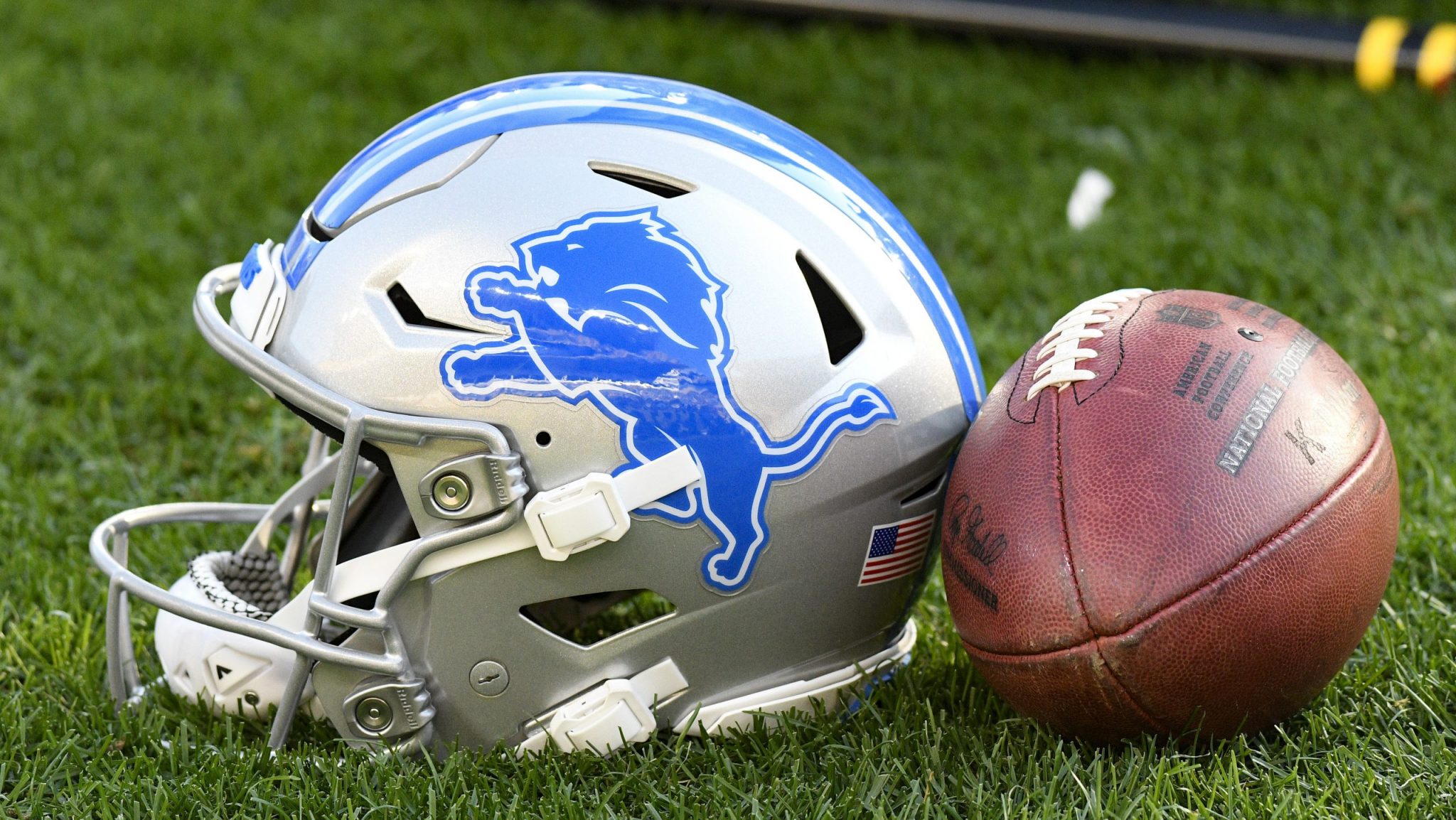 Detroit Lions helmet and football.