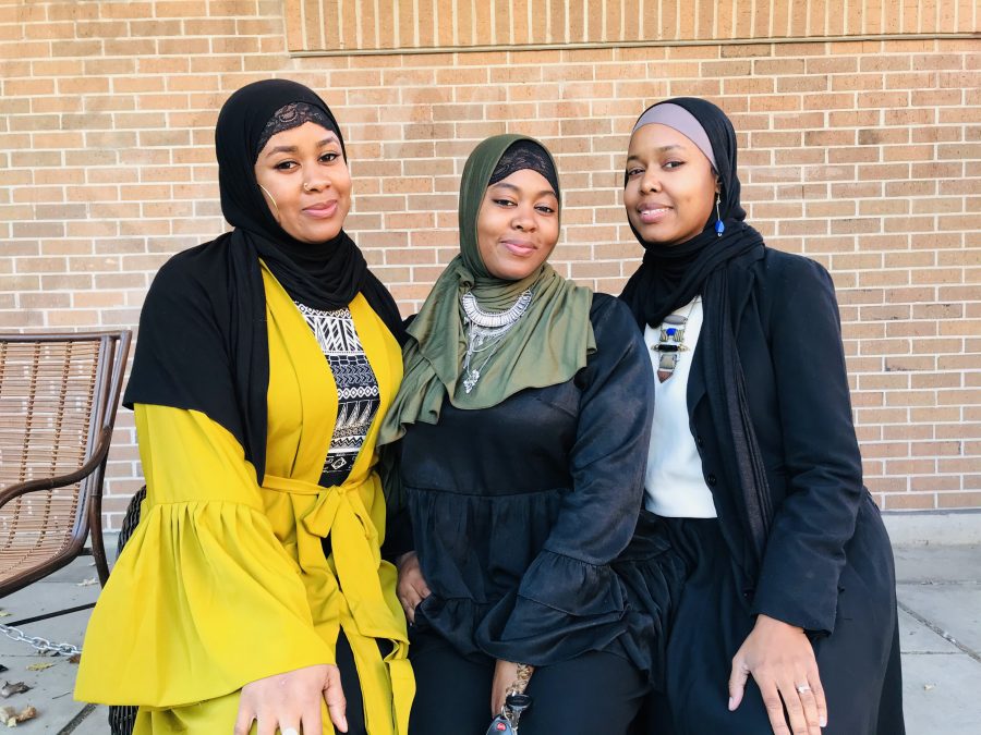 Sisters Aliyah, Laila and Taqwa Mahdi posing in front of The Social Loft in Hamtramck.