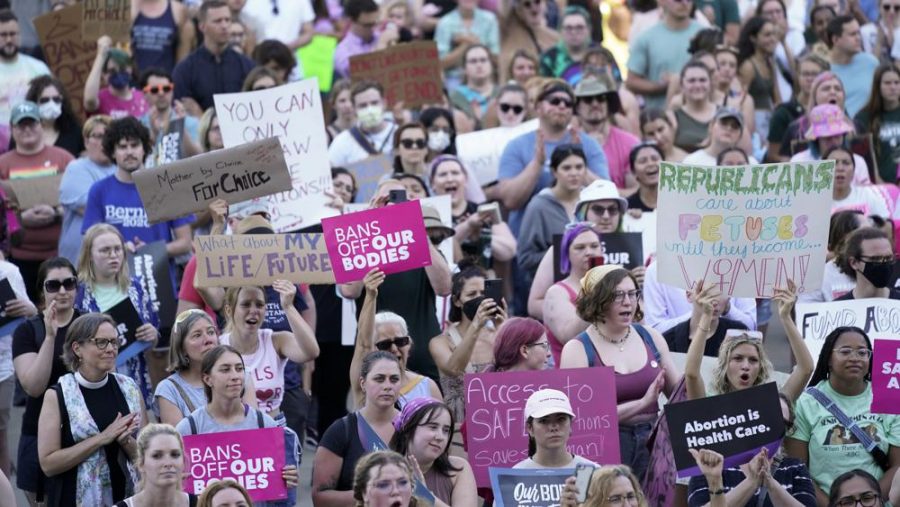 Abortion rights protesters attend a rally outside the state Capitol in Lansing, Mich., on June 24, 2022, following the United States Supreme Court's decision to overturn Roe v. Wade. Voters will decide whether to place abortion rights in the Michigan Constitution, the state Supreme Court declared Thursday, Sept. 8, 2022, settling the issue a day before the fall ballot must be completed. (AP Photo/Paul Sancya, File)