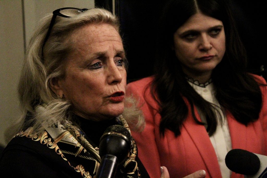 Debbie Dingell talks with Haley Stevens at the Oakland University gubernatorial debates in October 2022.