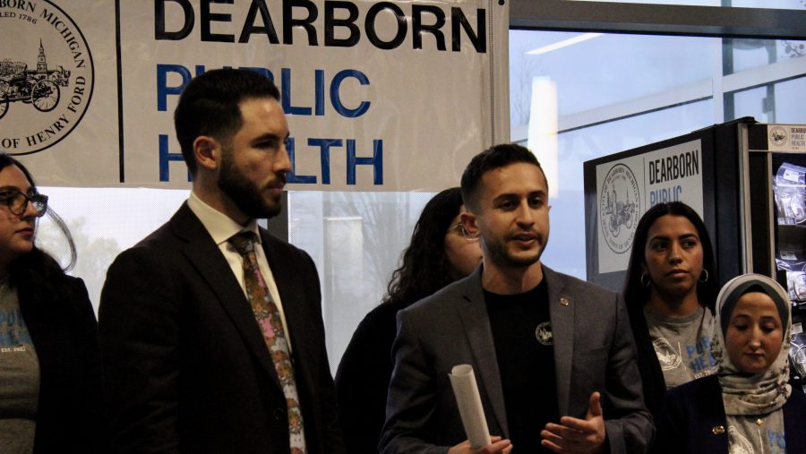 Dearborn Director of Public Health Ali Abazeed (right) speaks about the installation of a NARCAN vending machine in the lobby of the city's transit center, Nov. 16, 2022.