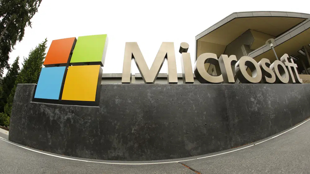 This July 3, 2014, file photo, shows the Microsoft Corp. logo outside the Microsoft Visitor Center in Redmond, Wash.