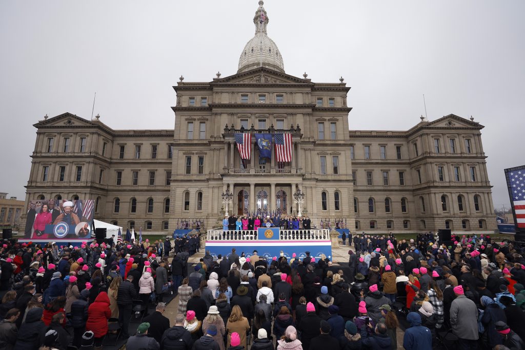 Imam Mohammad Ali Elahi delivers a prayer during inauguration ceremonies, Sunday, Jan. 1, 2023, outside the state Capitol in Lansing, Mich.