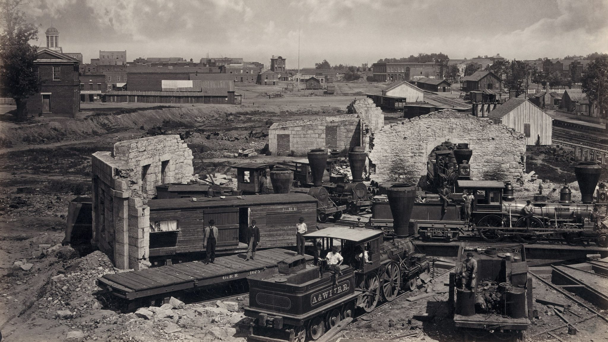 Atlanta, Georgia shortly after the end of the American Civil War showing the city's railroad roundhouse in ruins. Albumen print.