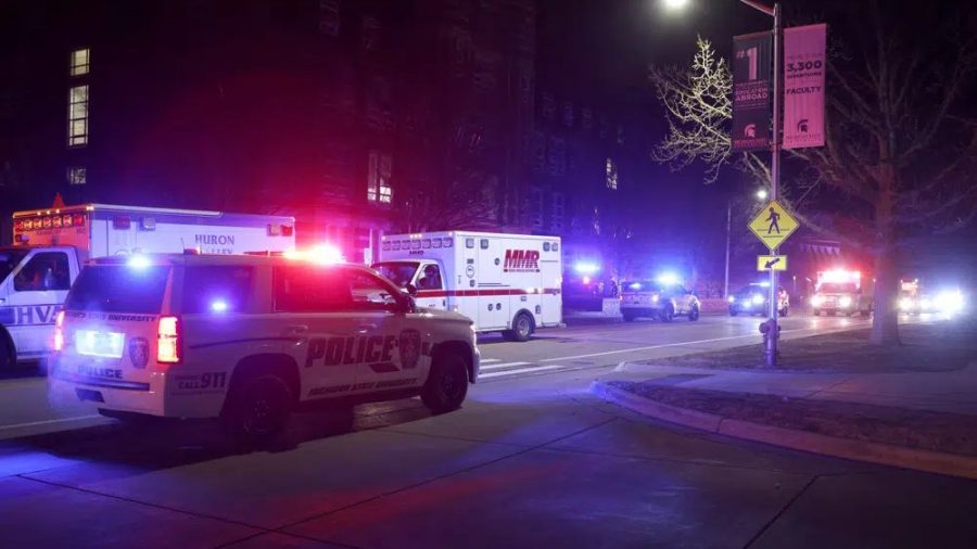 First responders stage outside Berkey Hall on the campus of Michigan State University, late Monday, Feb. 13, 2023, in East Lansing, Mich.