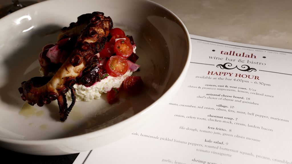 Photo of a dinner plate and menu from Tallulah in Birmingham, Mich.