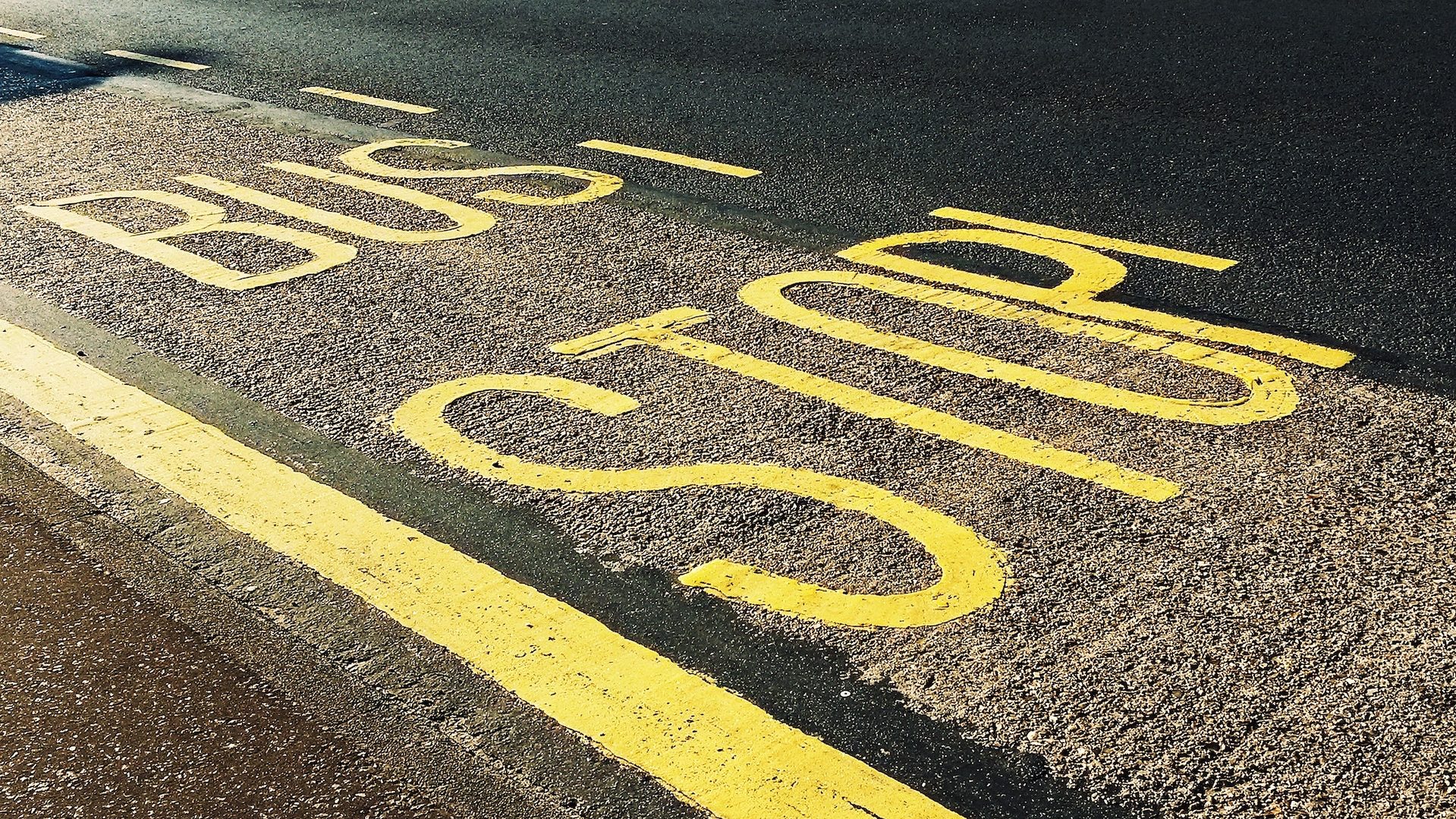 Bus Stop Printed on Asphalt Road