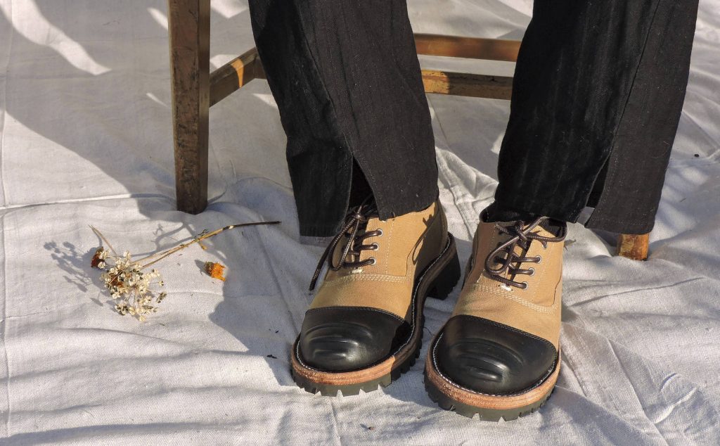 tan and black oxford-style shoes