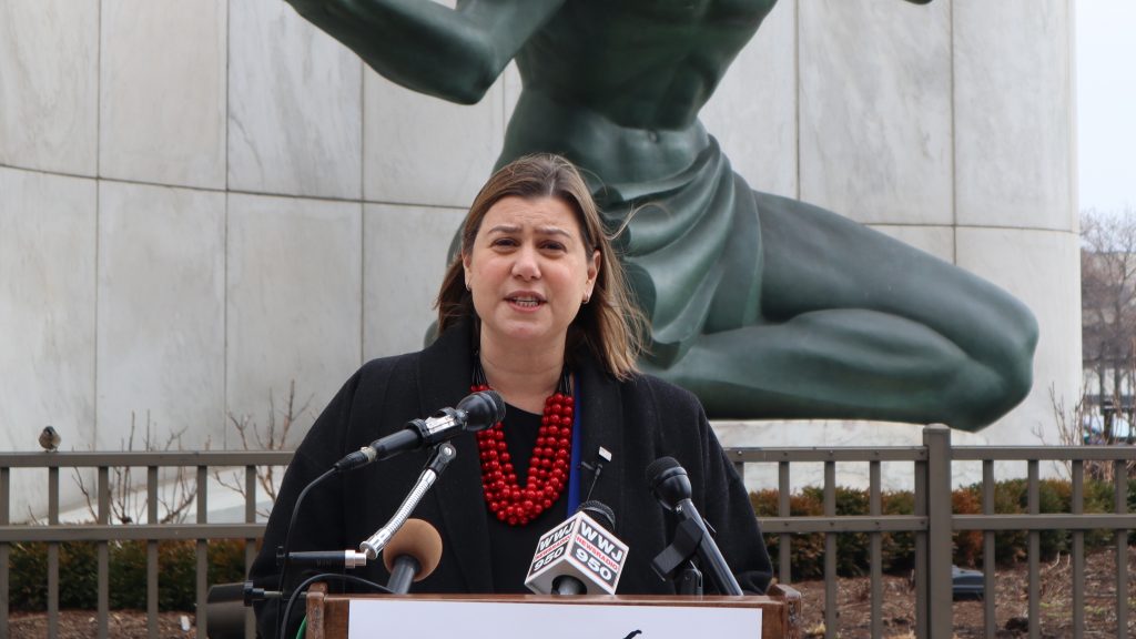 Elissa Slotkin speaks in front of the Spirit of Detroit