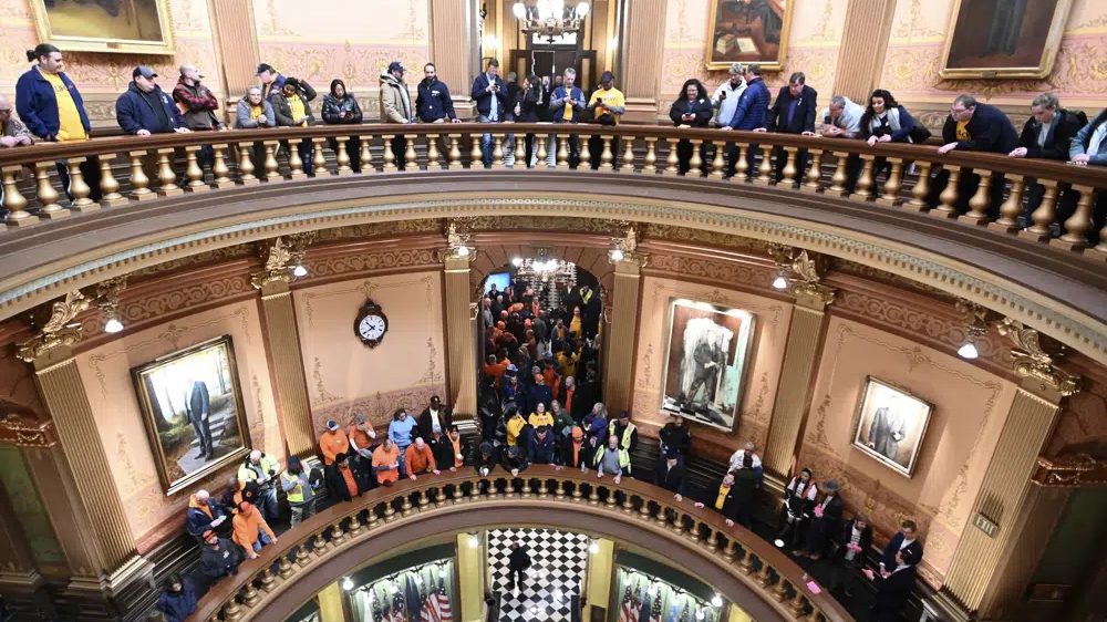 FILE - Union members and supporters chant in the Capitol rotunda, Tuesday morning, March 14, 2023, as they wait for a Right To Work bill to be voted on.