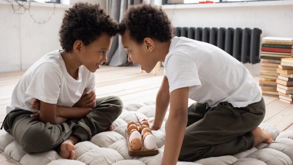 Stock photo of brothers facing each other.