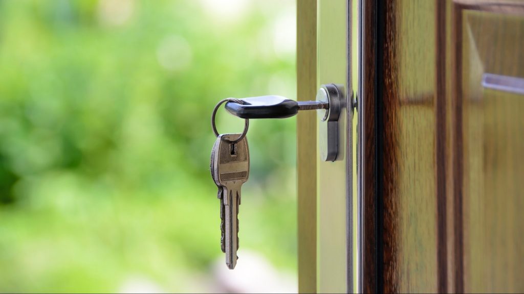 Photo of key inserted in door lock.