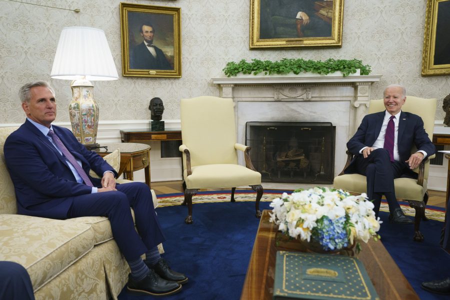 Speaker of the House Kevin McCarthy of Calif., left, listens as President Joe Biden speaks before a meeting on the debt limit in the Oval Office of the White House, Tuesday, May 9, 2023, in Washington.