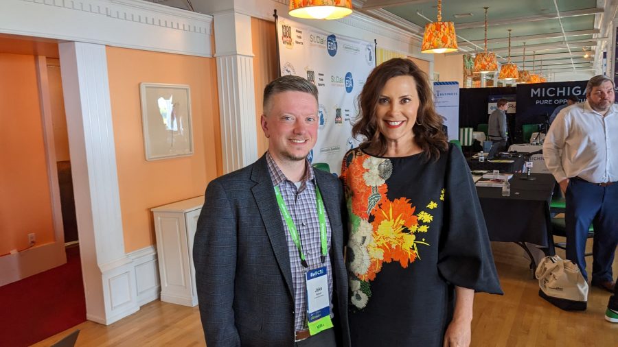 Jake Neher smiles with Gretchen Whitmer