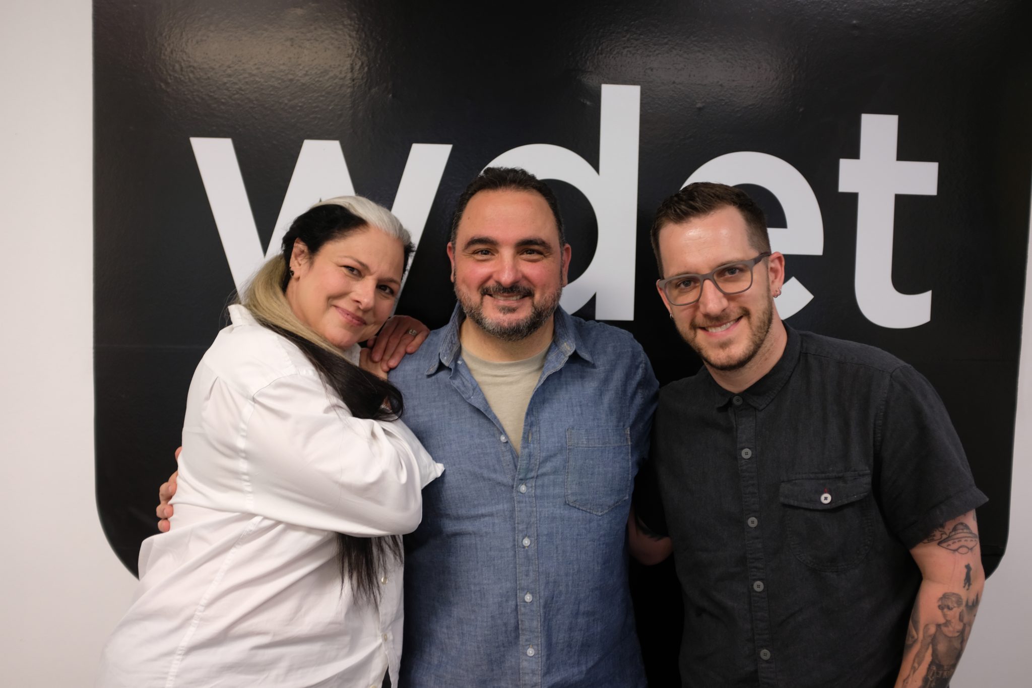 Fred Sareini (middle) stands with Ann Delisi and James Rigato at WDET in Detroit, Mich.