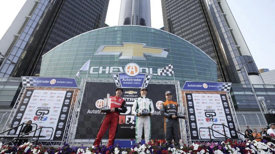 Winner Alex Palou, center, celebrates with second-place finisher Will Power, left, and third-place finisher Felix Rosenqvist , right, after the IndyCar Detroit Grand Prix auto race in Detroit, Sunday, June 4, 2023. (AP Photo/Paul Sancya)