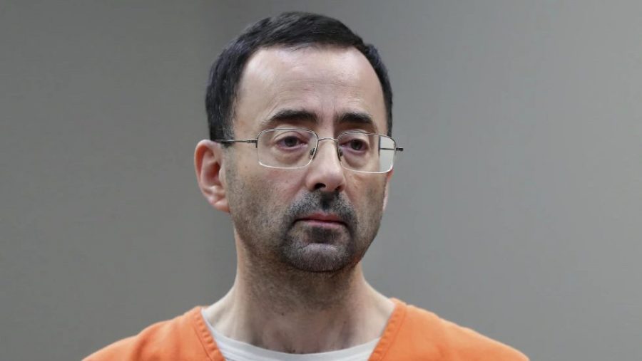 FILE - In this Nov. 22, 2017 file photo, Dr. Larry Nassar appears in court for a plea hearing in Lansing, Mich.