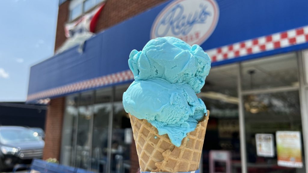 A double scoop of Blue Moon ice cream in a waffle cone