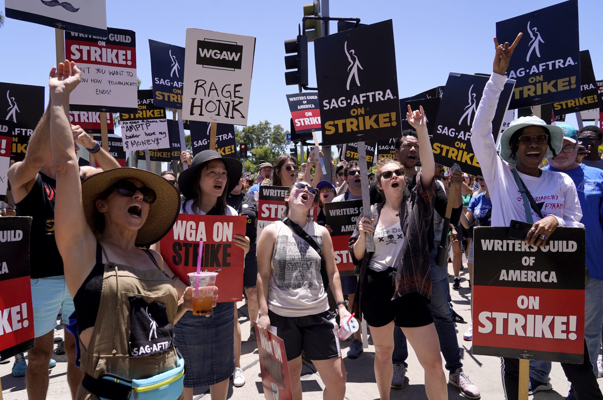 Striking writers and actors take part in a rally outside Paramount studios in Los Angeles