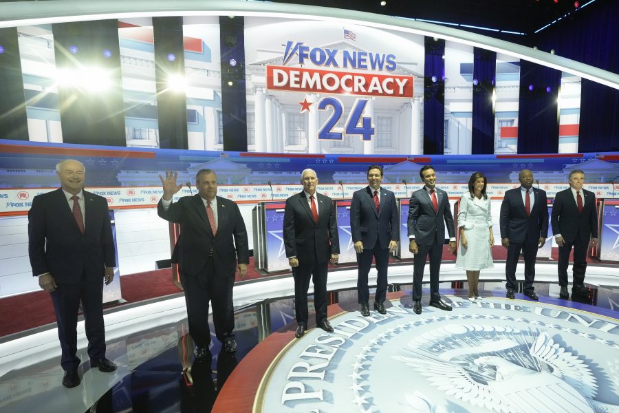 Republican presidential candidates, from left, former Arkansas Gov. Asa Hutchinson, former New Jersey Gov. Chris Christie, former Vice President Mike Pence, Florida Gov. Ron DeSantis, businessman Vivek Ramaswamy, former U.N. Ambassador Nikki Haley, Sen. Tim Scott, R-S.C., and North Dakota Gov. Doug Burgum stand on stage before a Republican presidential primary debate hosted by FOX News Channel Wednesday, Aug. 23, 2023, in Milwaukee. (AP Photo/Morry Gash)