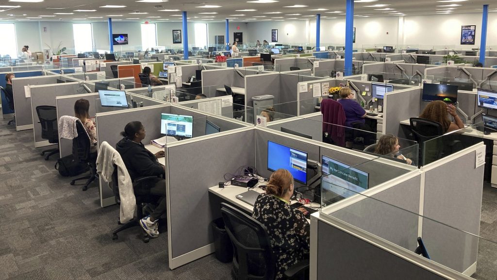 Workers at a Medicaid call center field questions and review information regarding eligibility determinations, Aug. 16, 2023.