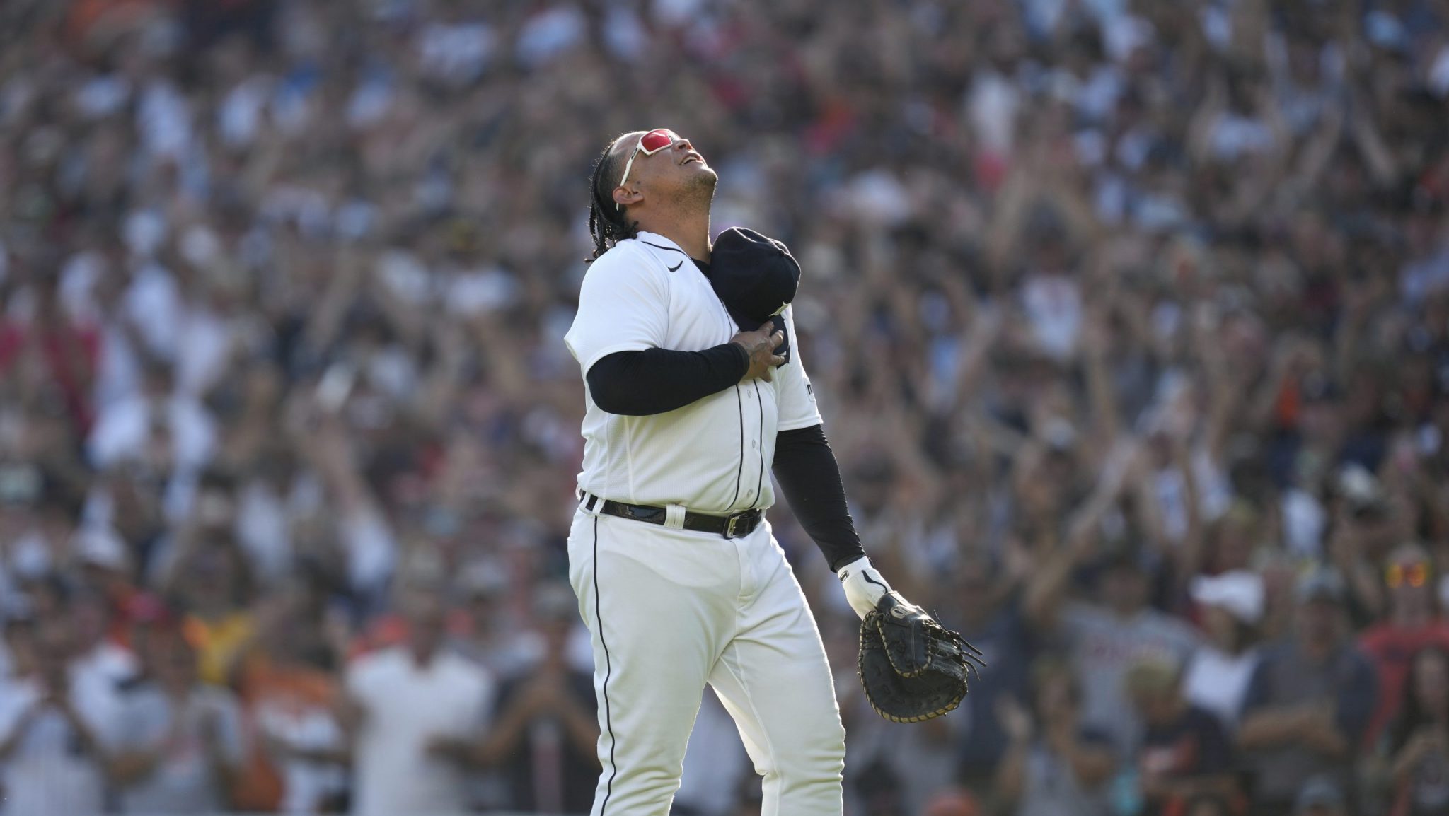 Miguel Cabrera holds his hat over his heart in front of a sold-out crowd